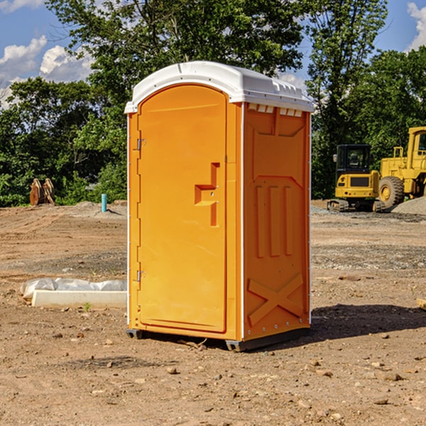 what is the cost difference between standard and deluxe portable toilet rentals in Harmony